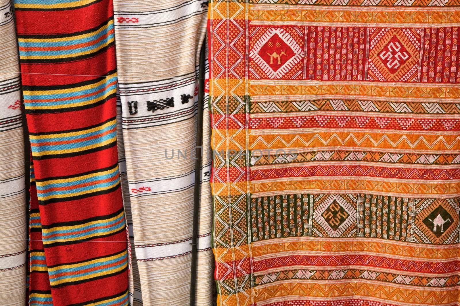 Selection of wonderfully bright colourful cloth at a market stall in Fez, Morocco