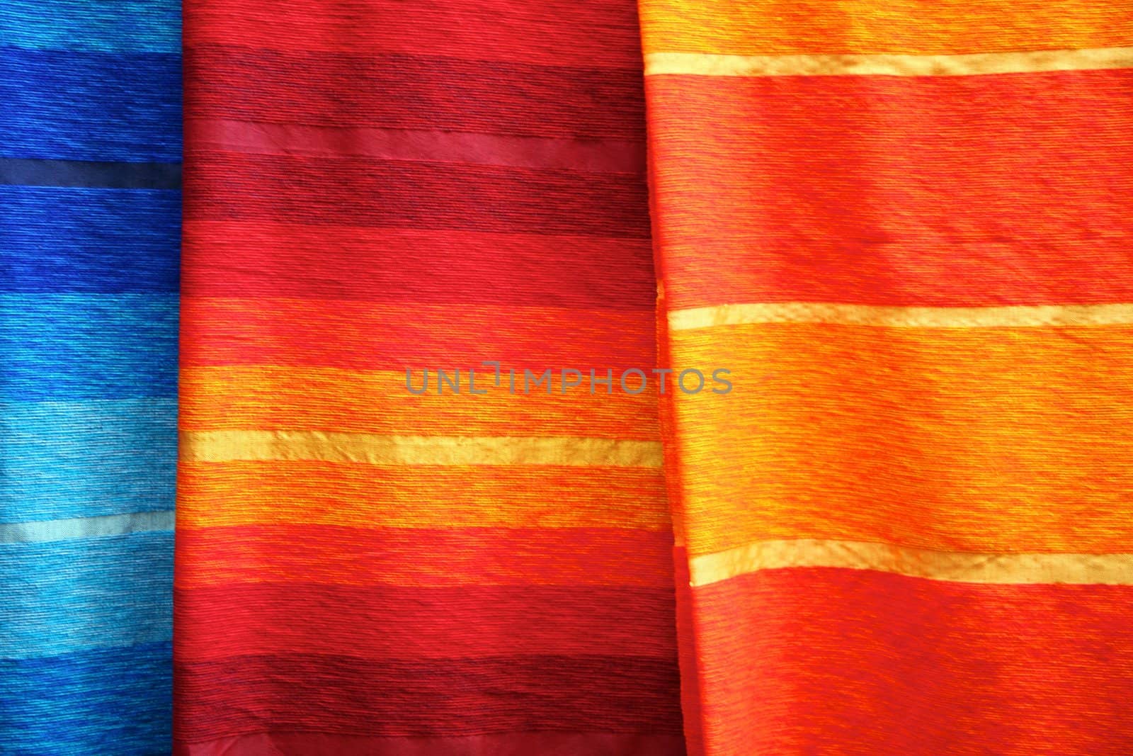 Selection of wonderfully bright colourful cloth at a market stall in Fez, Morocco