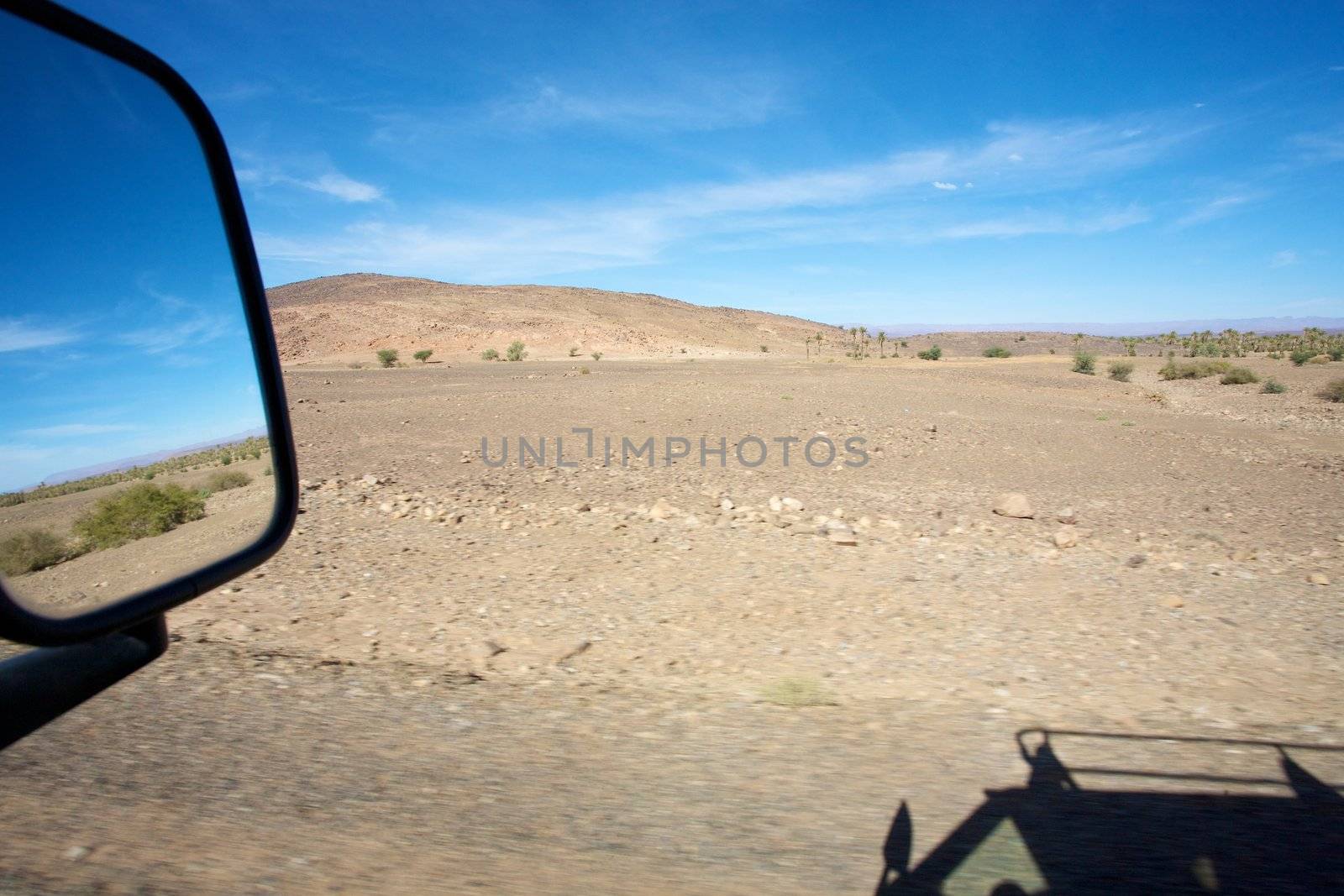 A four wheel drive car on a road in Morocco