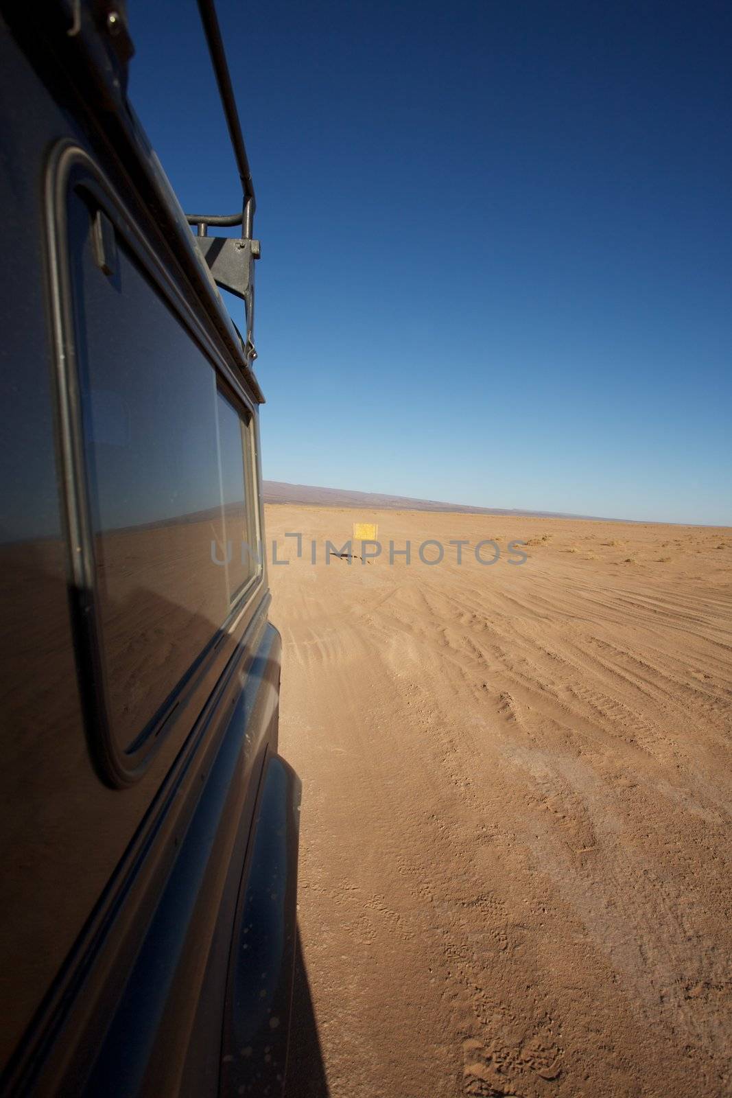 A four wheel drive car on a desert road in Morocco