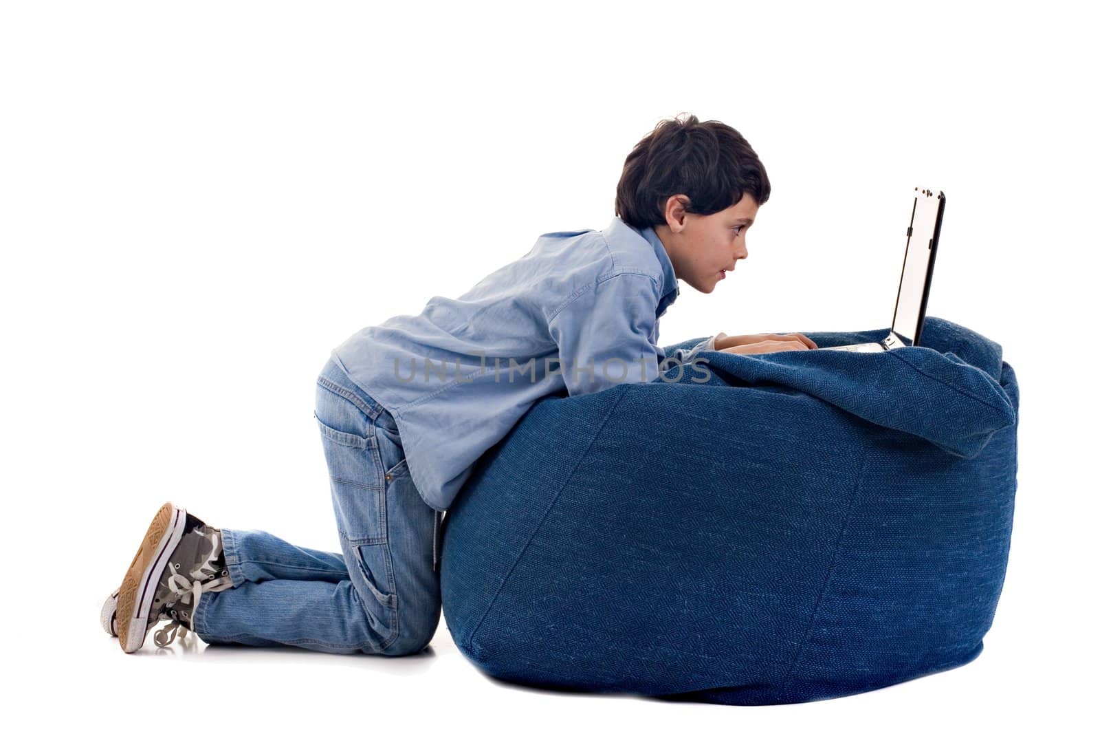 Cute Kid using a laptop, over white background