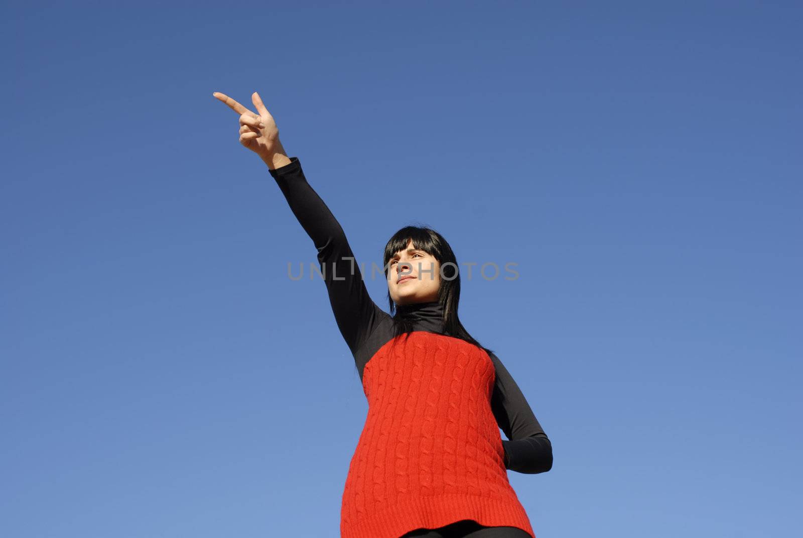 young casual woman with the sky as background