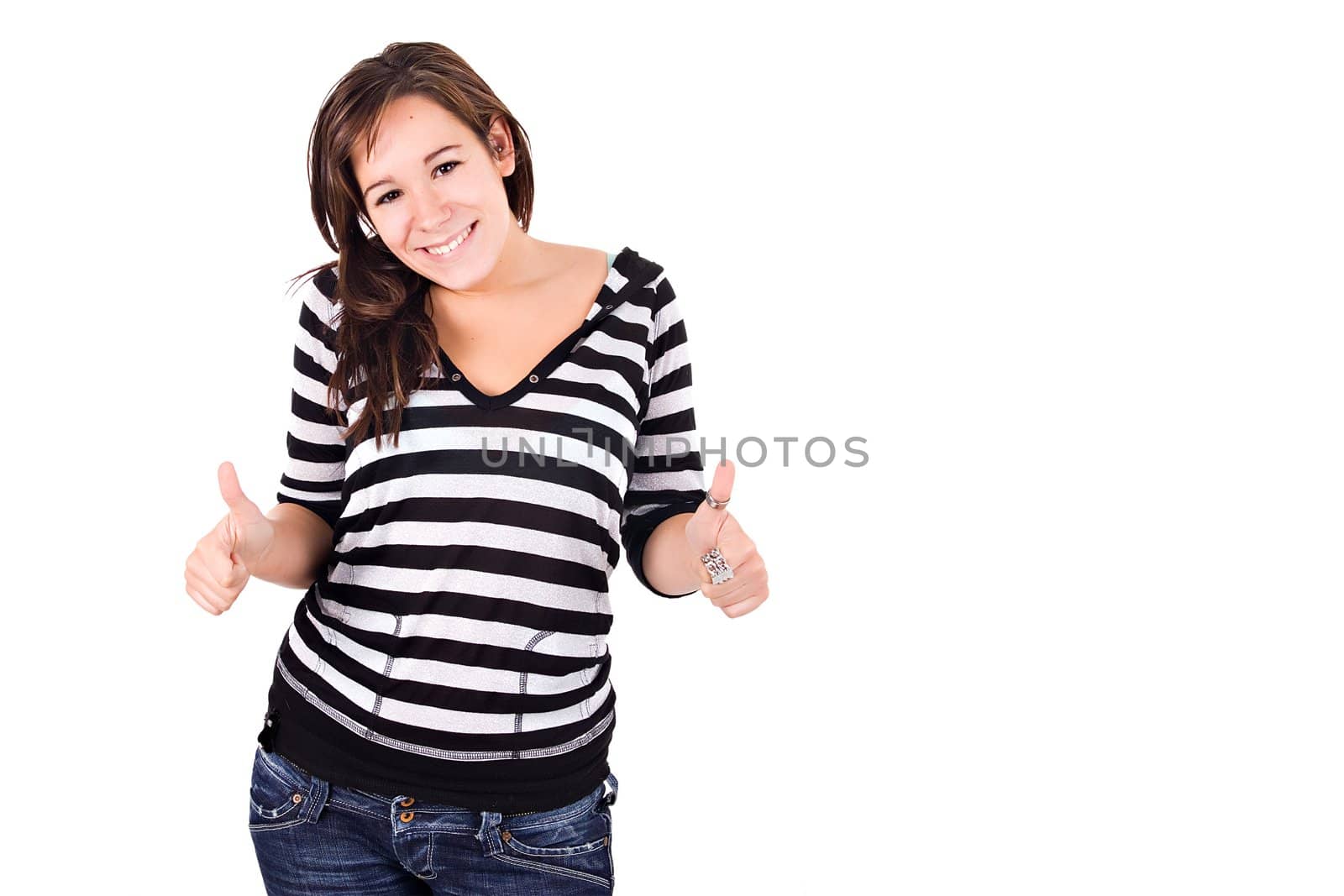 Young woman smiling with thumbs up. Copy space.