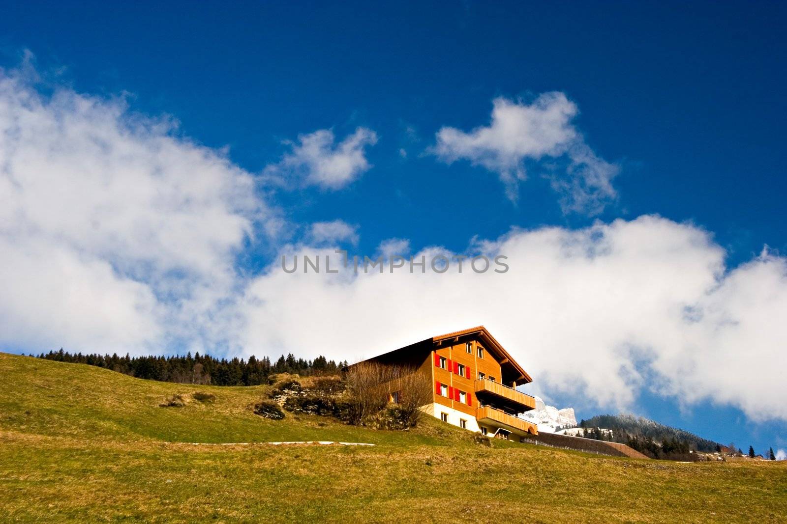 Typical rural house in Switzerland on a sunny day.