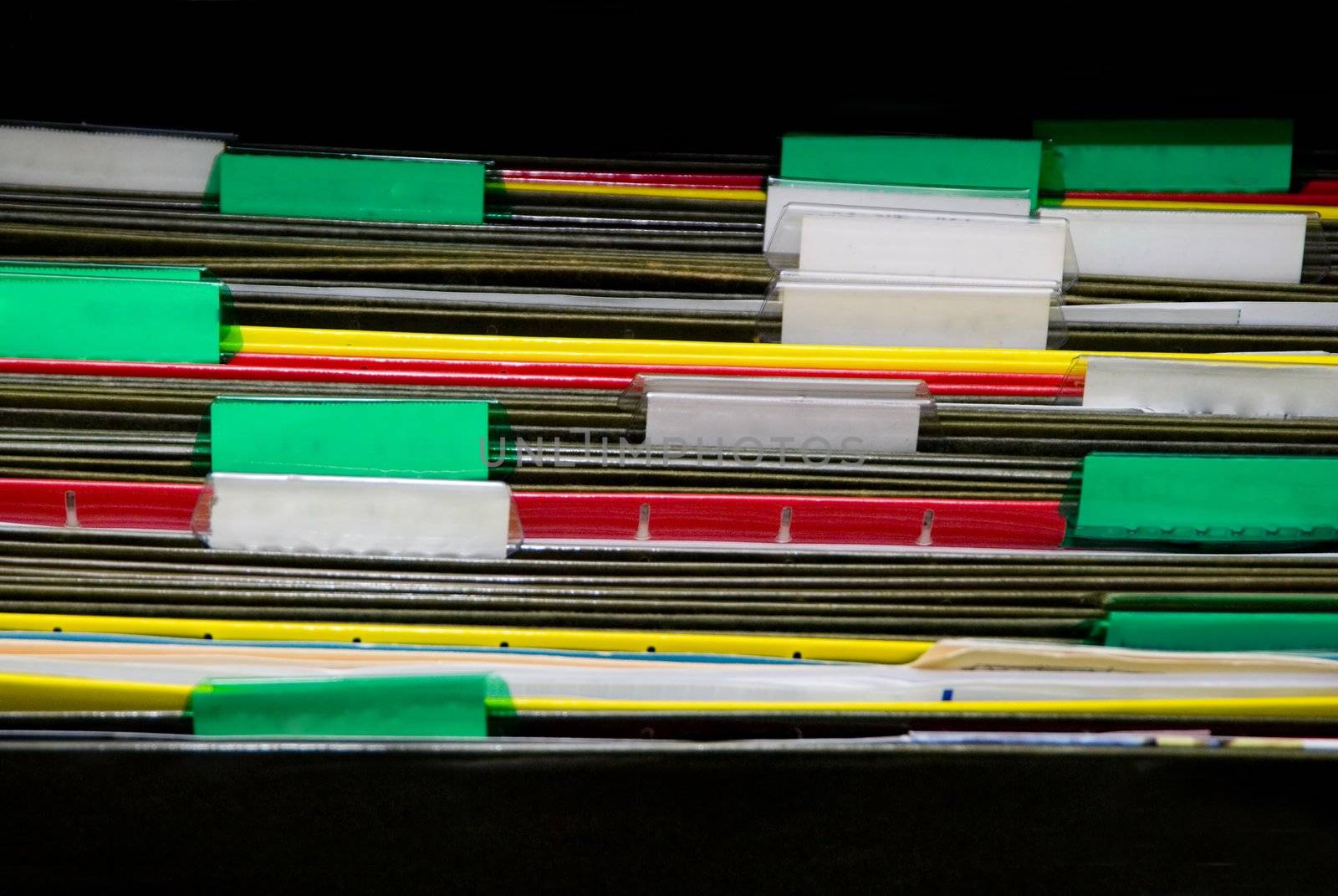 A set of organized file folders in an office
