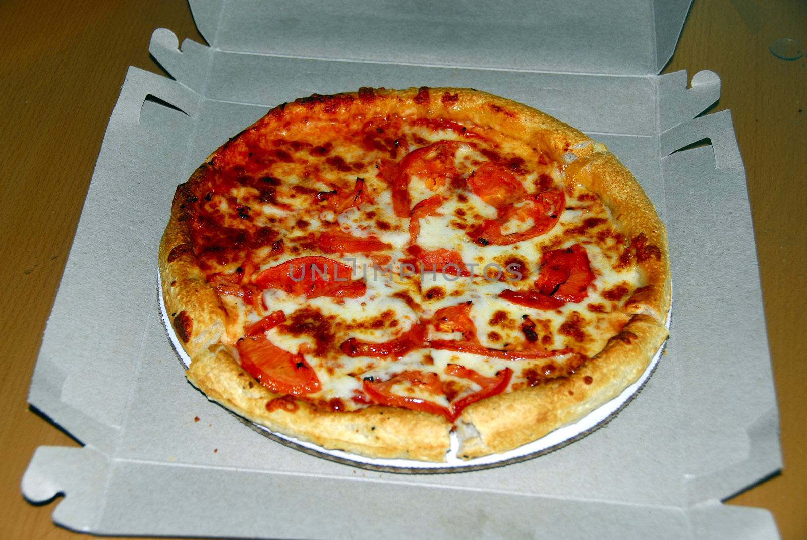 Freshly baked hot pizza after delivery and ready to eat