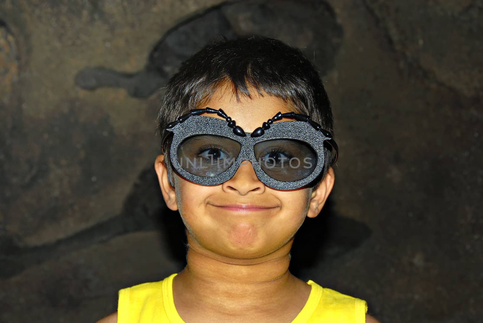 A handsome kid excited wearing funny googles