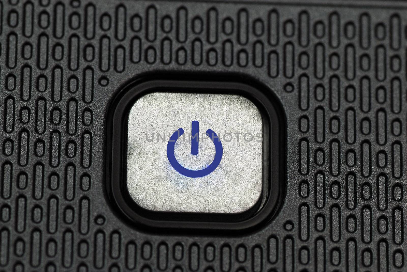 Macro shot of a power button on a laptop