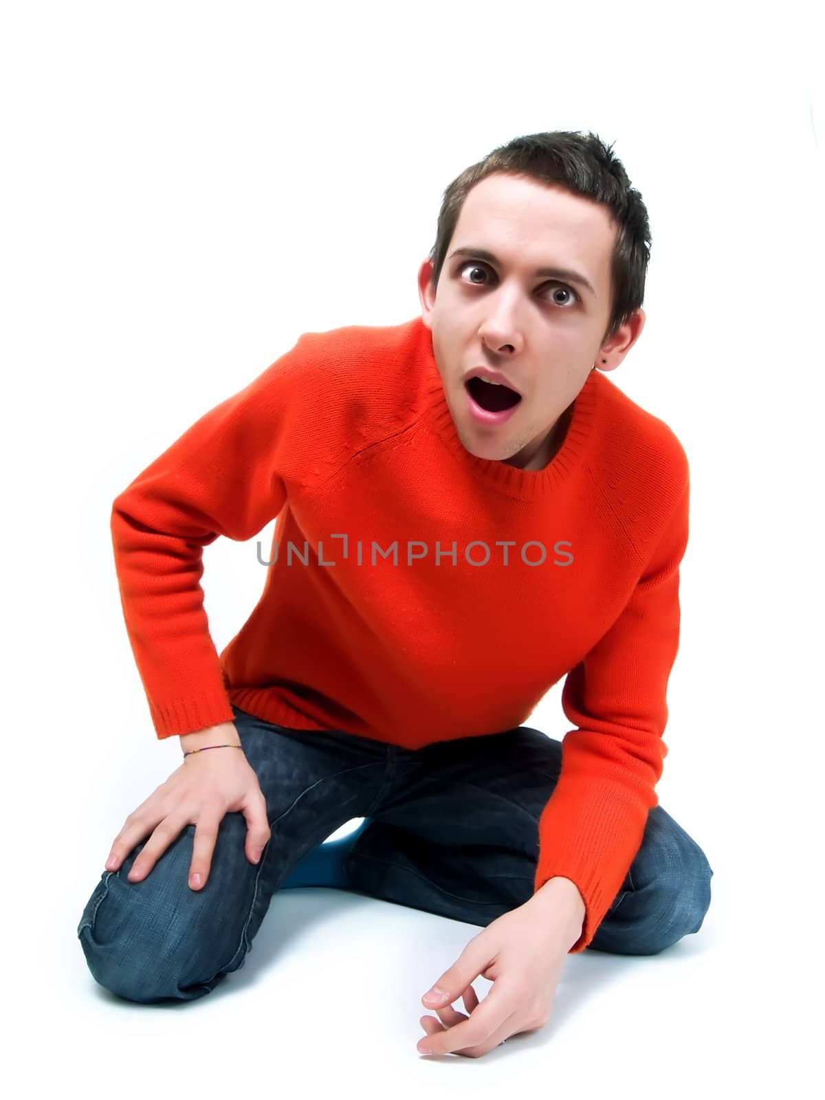 Amazed teenager on a white background