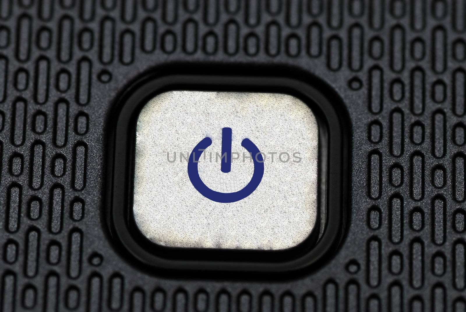 Macro shot of a power button on a laptop