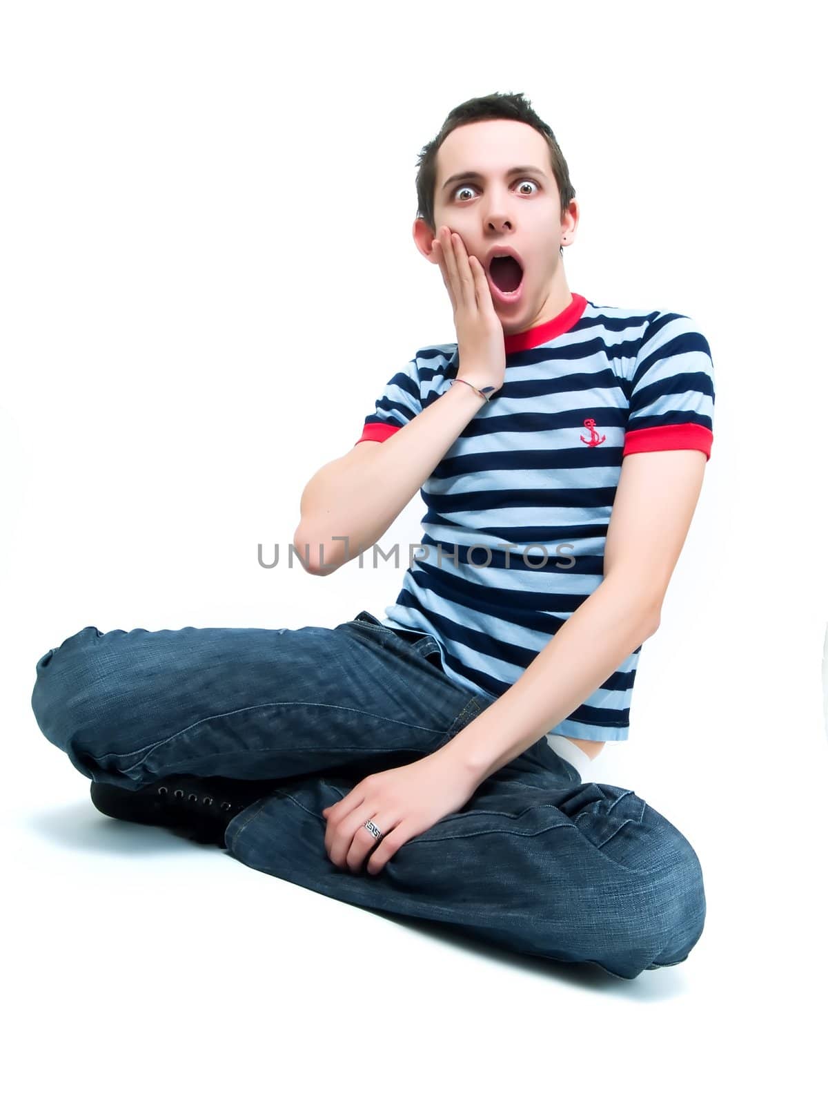 Amazed teenager on a white background