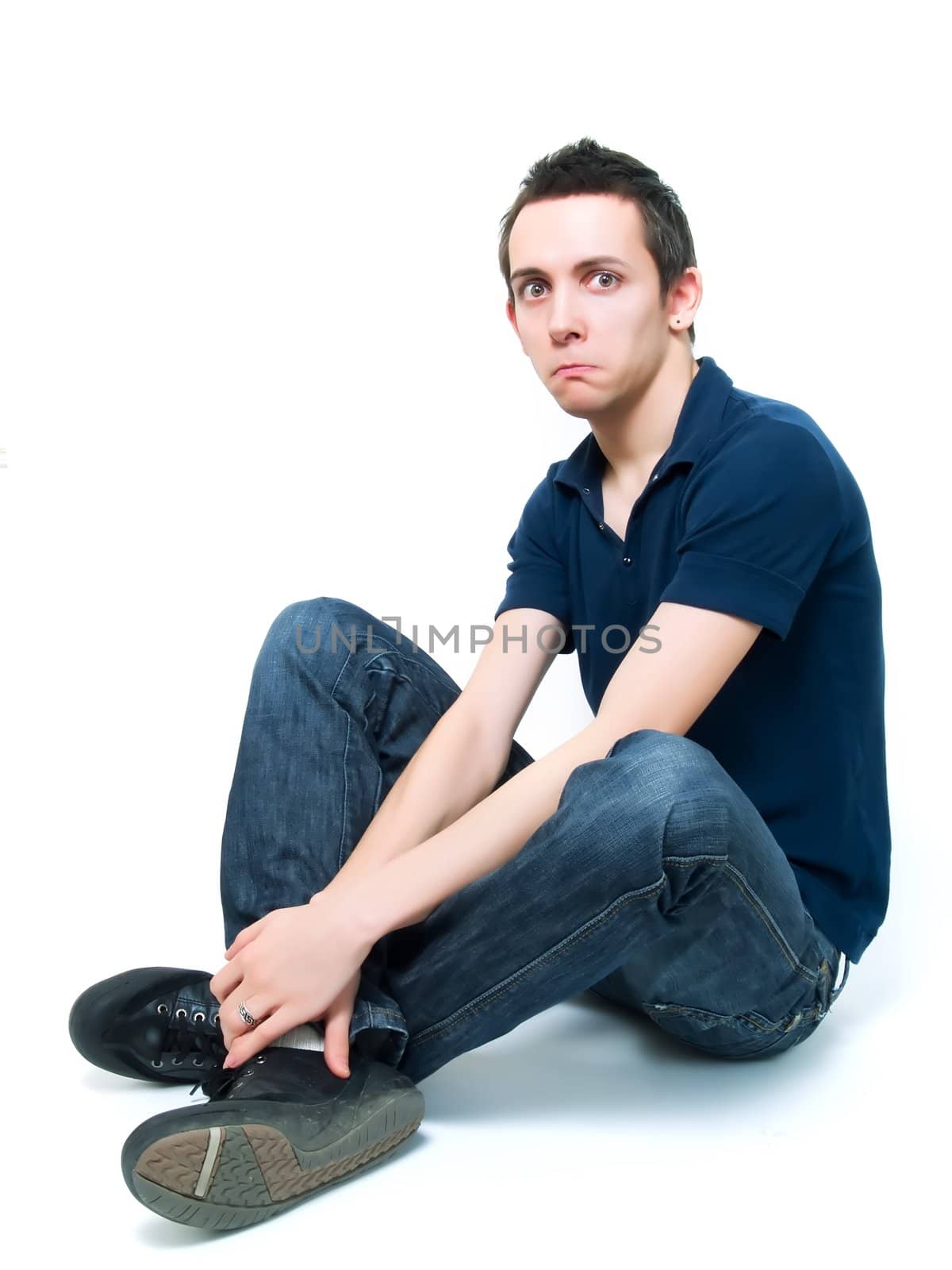 Happy teenager posing on a white background