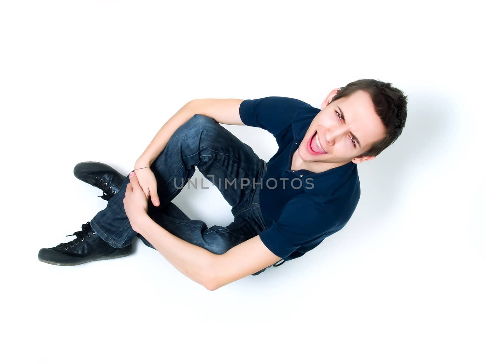 Happy young man posing on a white background