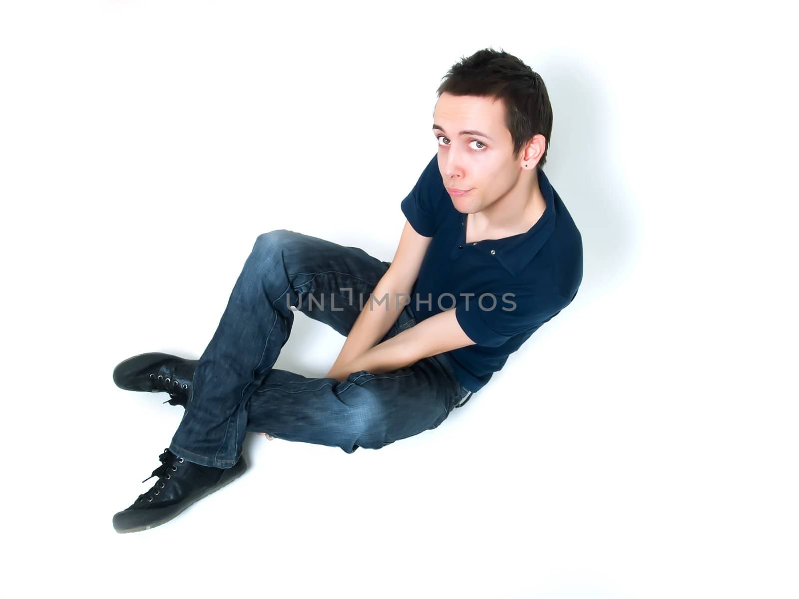 Happy young man posing on a white background