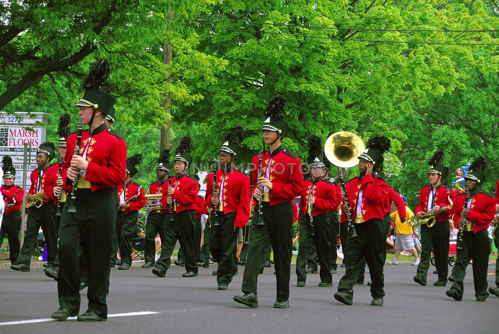 A grounp of band men playing at a local parade