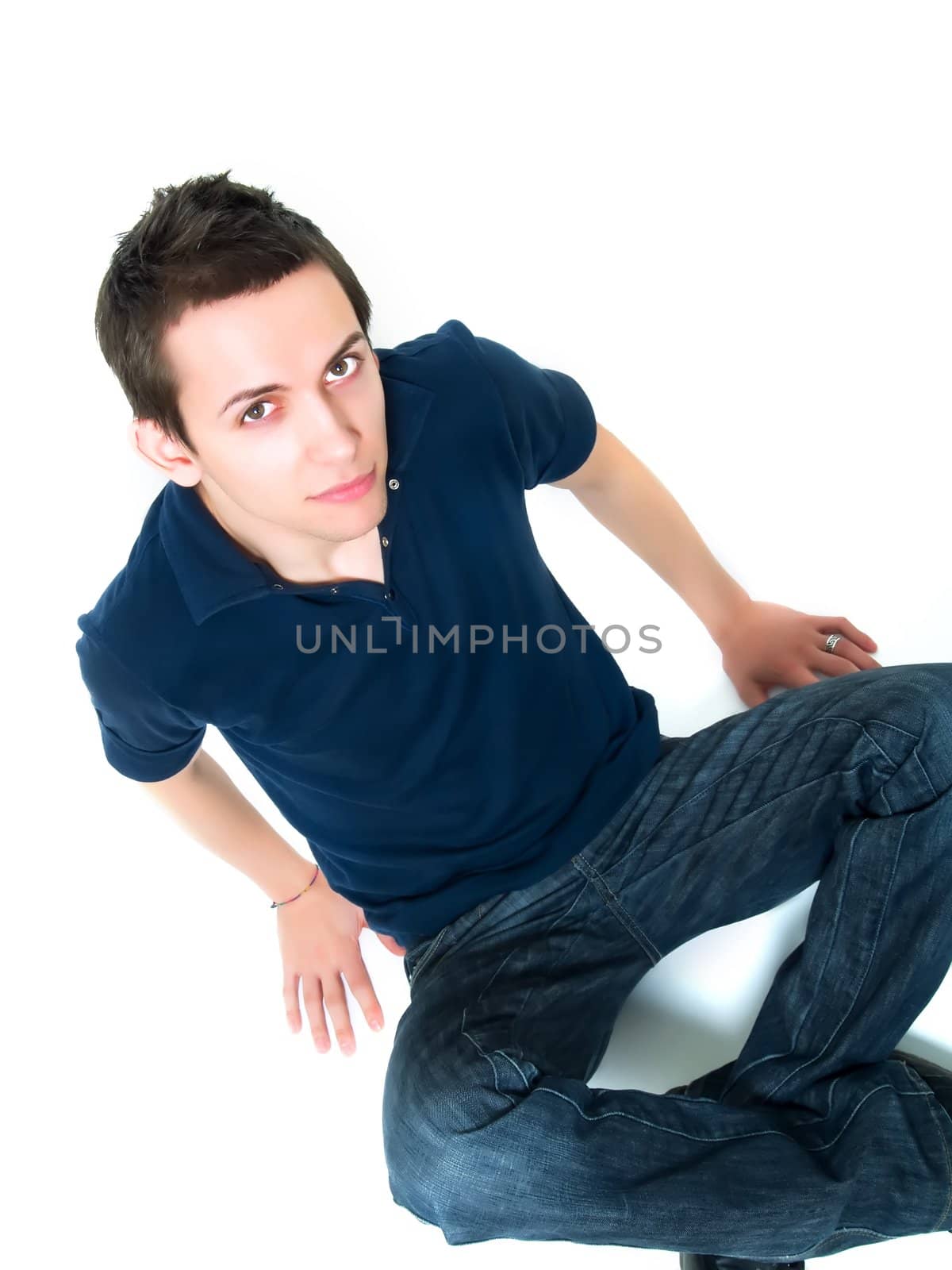 Happy young man posing on a white background