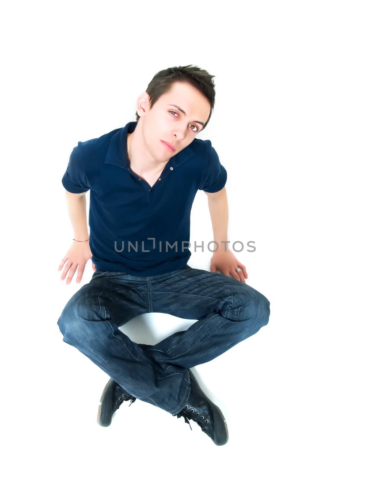 Happy young man posing on a white background