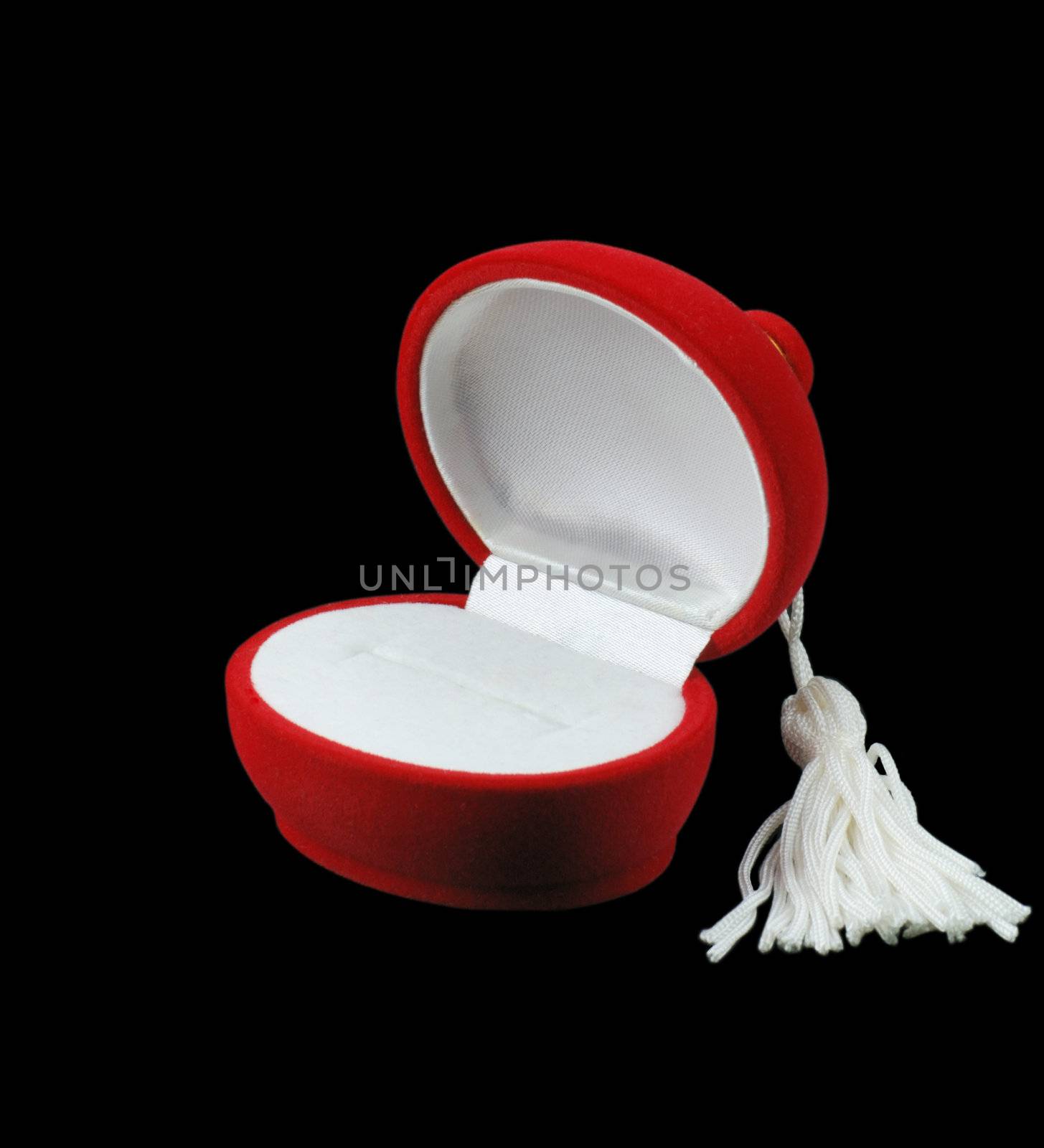 Casket under jewelry. The red and white satin on a black background