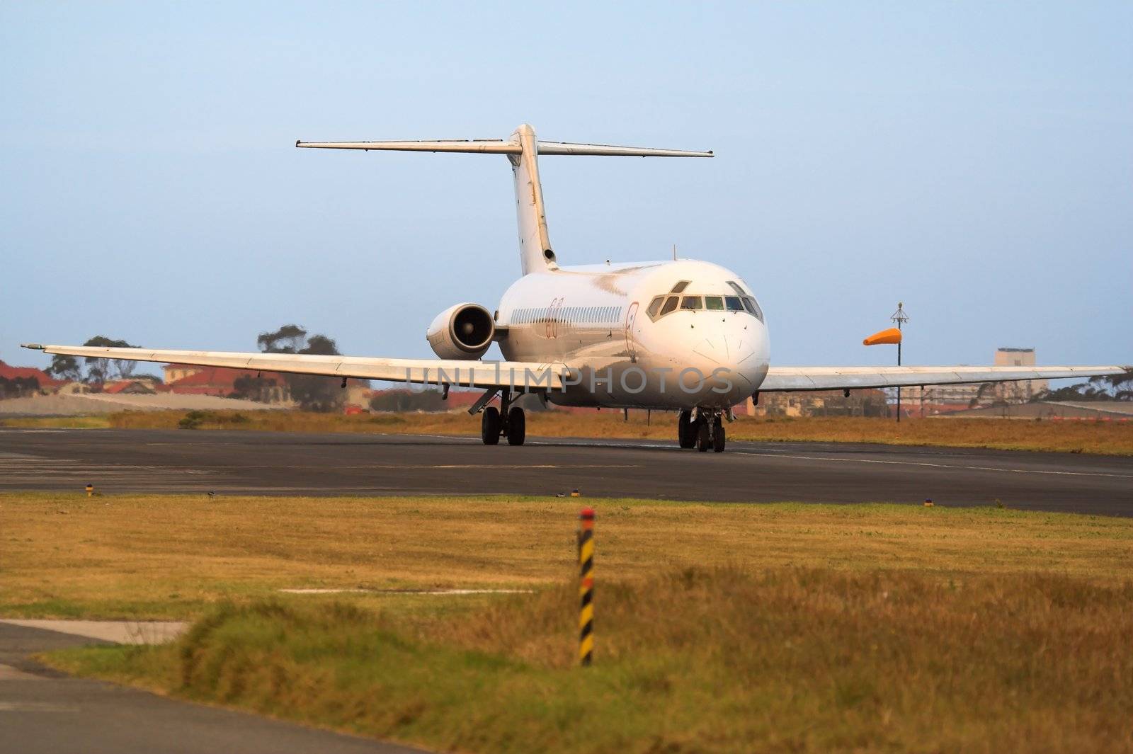 A passenger jetliner on the runway before take off
