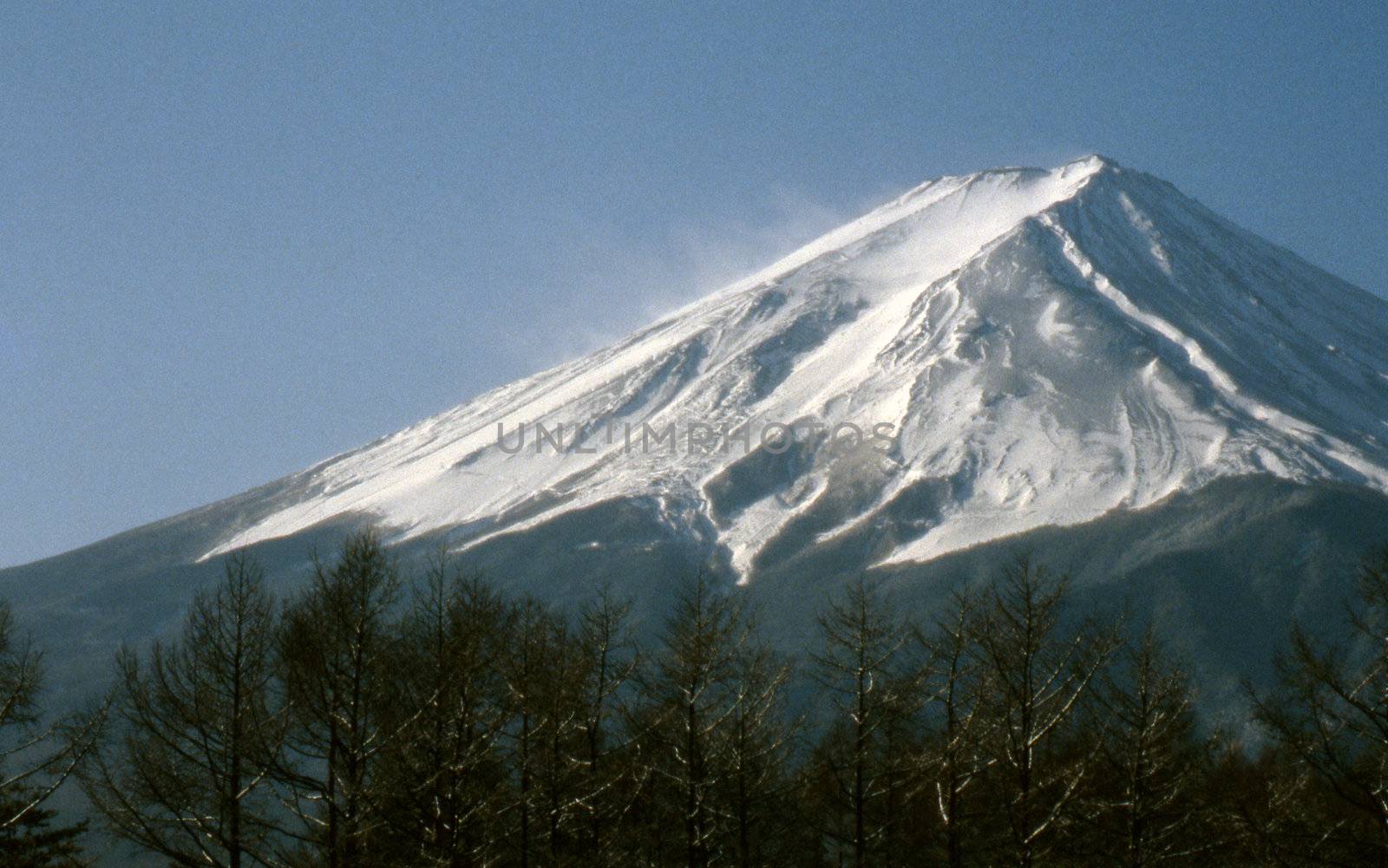 Mount Fuji, stands cold and  windswept.
