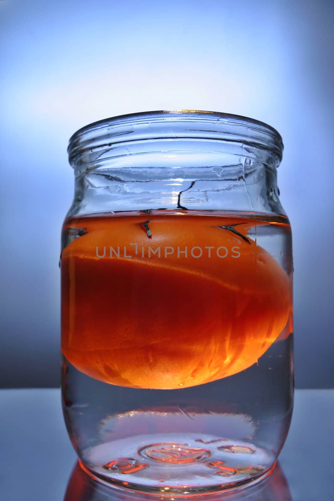 Tomato in a bottle with water