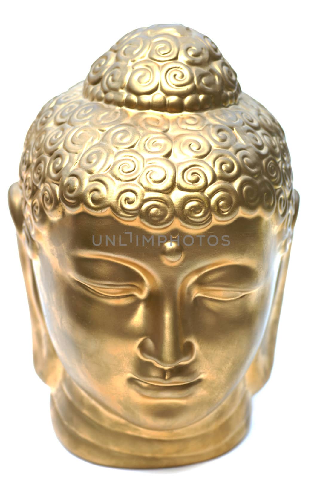 An isolated golden buddha head.               