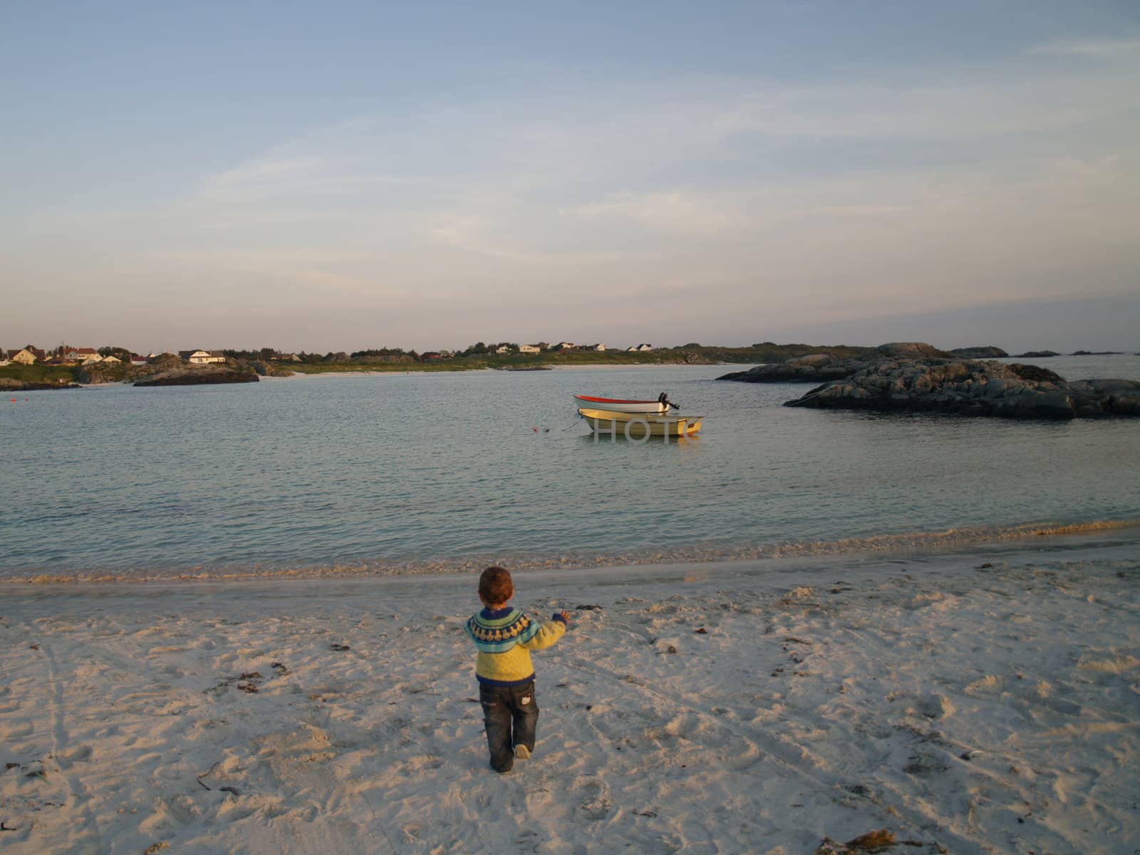 baby walking on beach