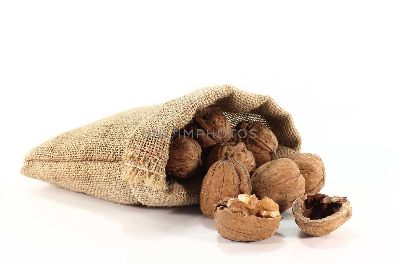 a burlap sack filled with walnuts