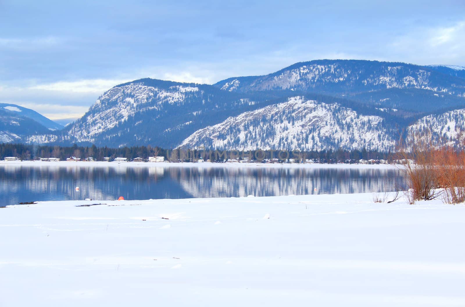 Reflection of snow covered mountain on clear lake