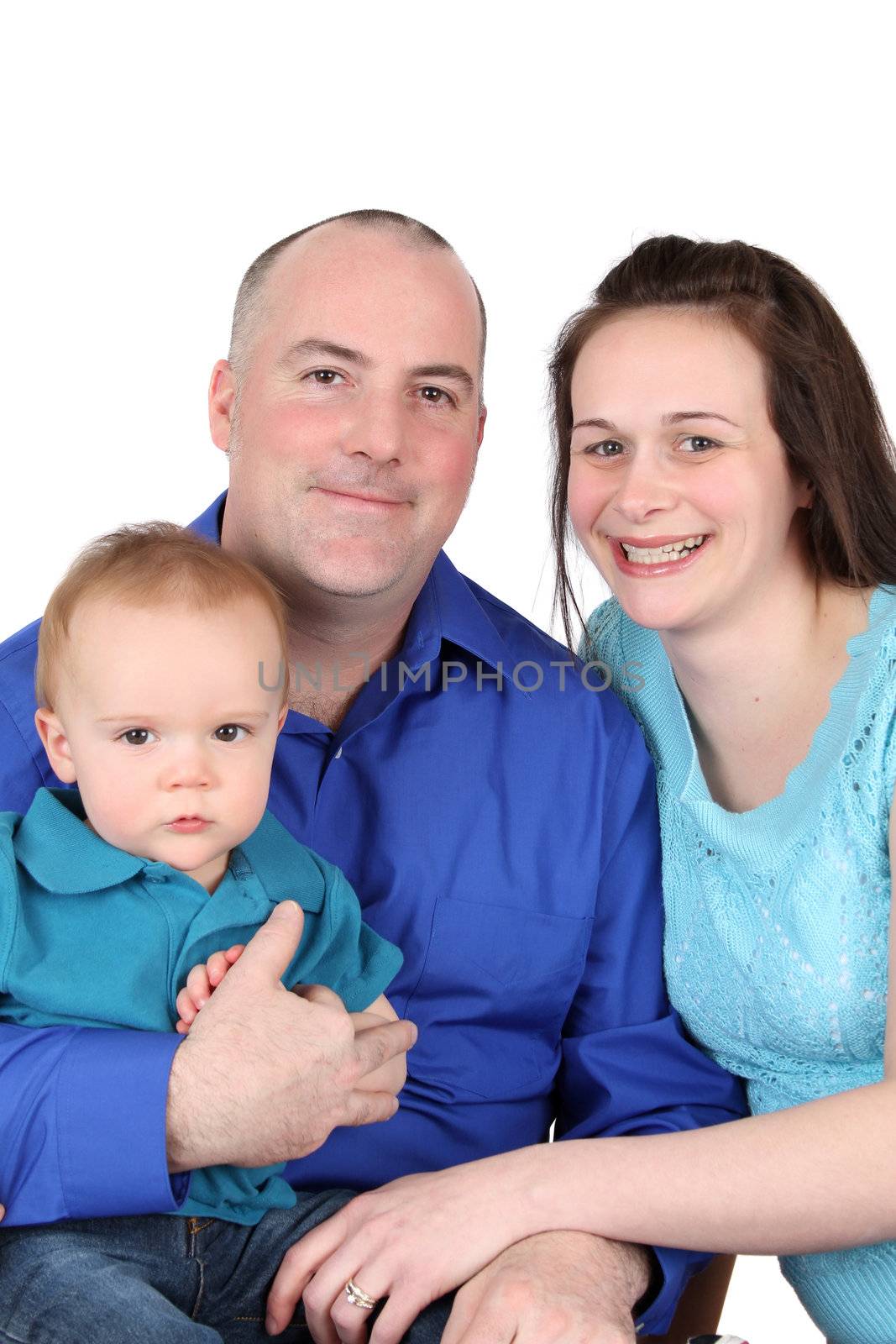 Family of three against a white background