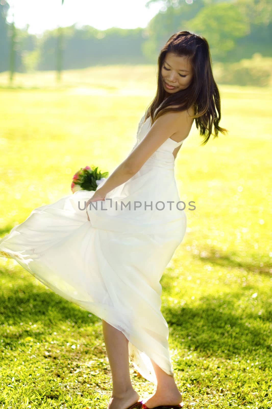 Asian bride walking at outdoor in a morning