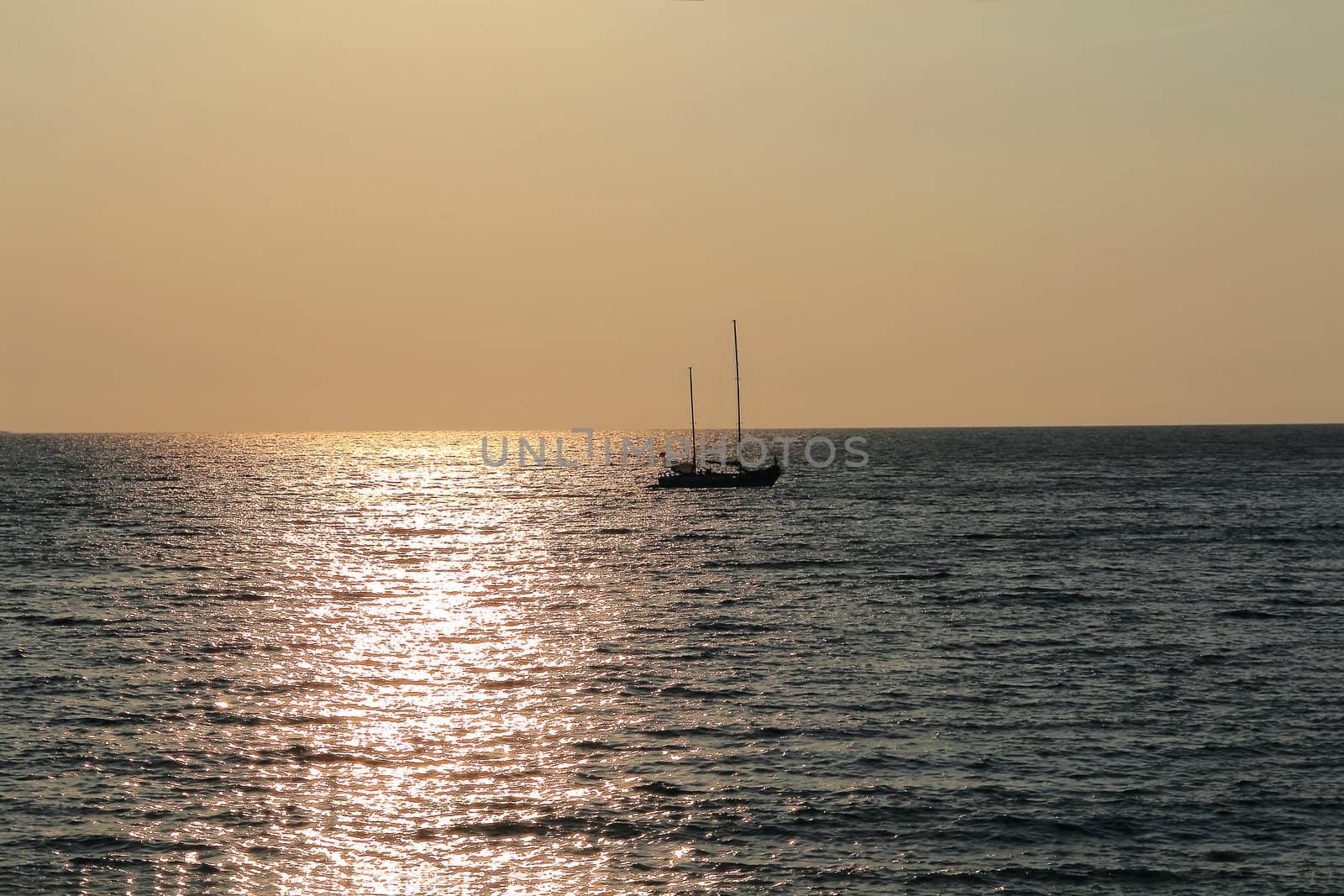 Landscape with calm sea and beautiful sailboat