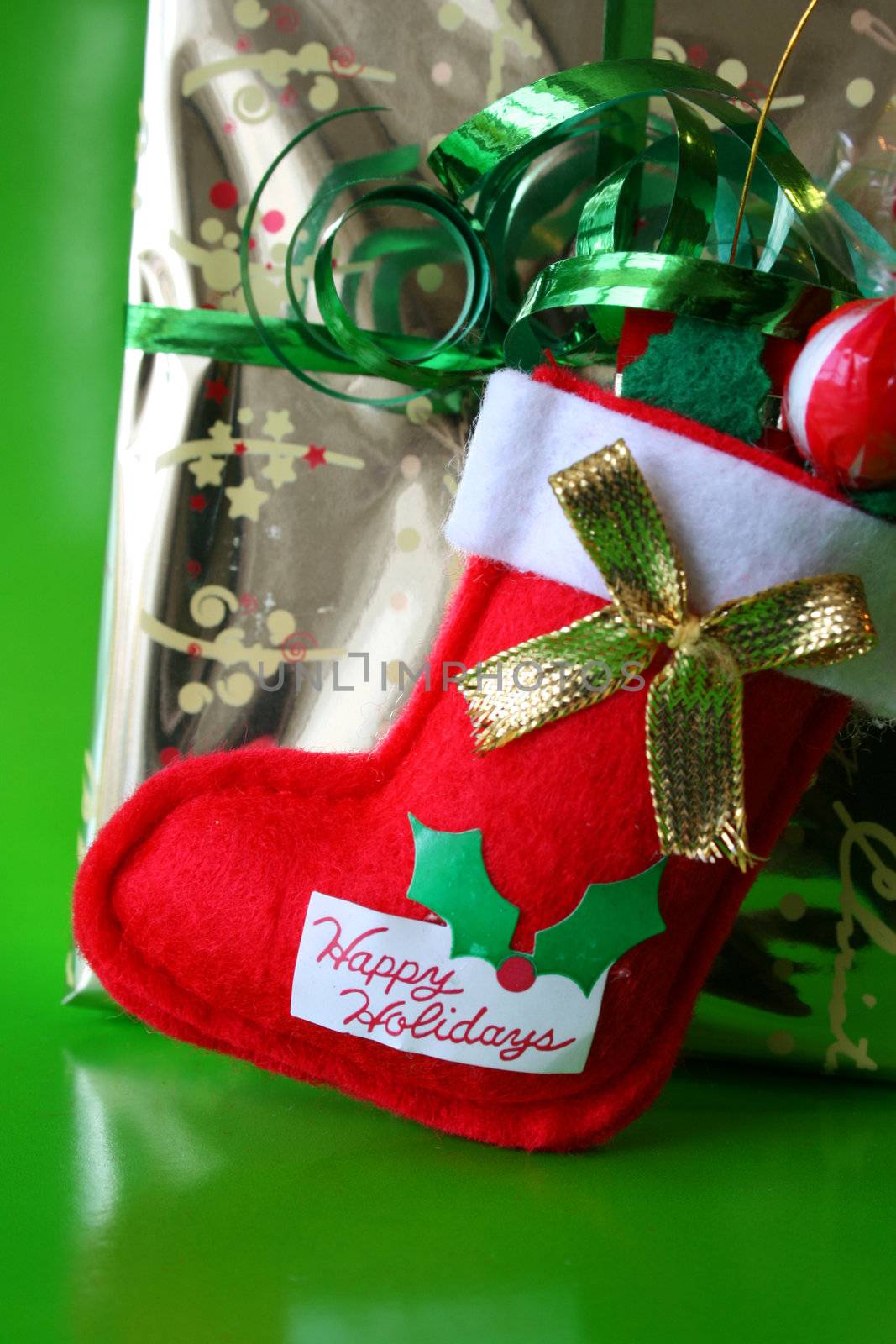 Christmas stocking against a gold wrapped present
