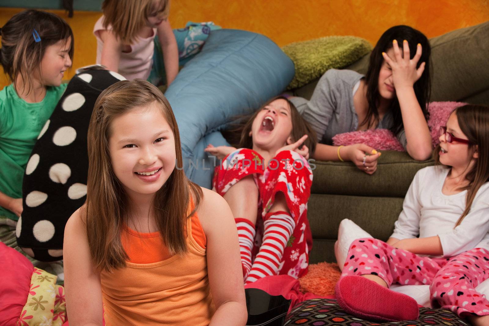 Happy little girl with friends at a sleepover