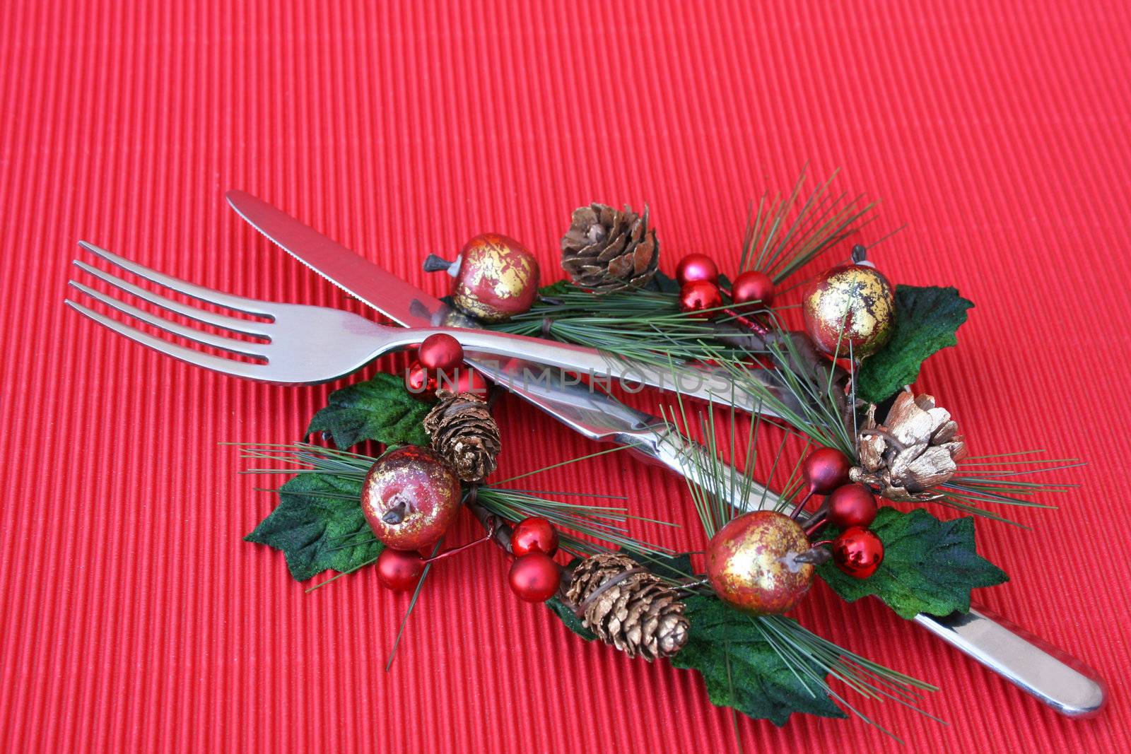 Knife and Fork in a christmas decoration as a table setting
