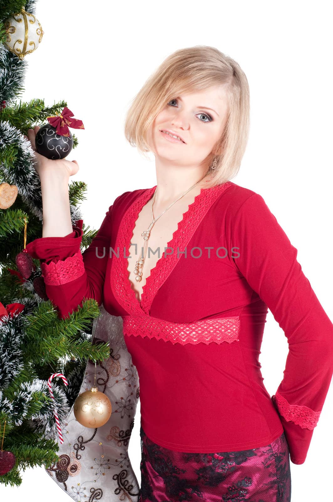 Happy woman with Christmas presents and tree isolated on white