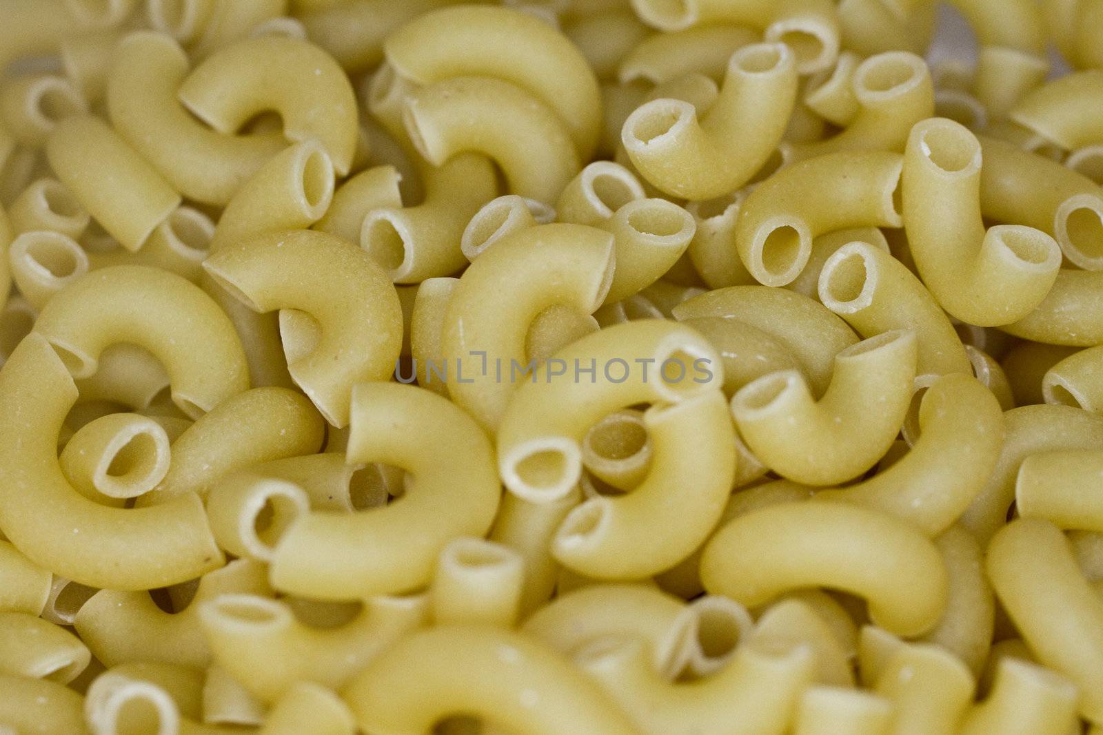 Uncooked Macoroni Elbow pasta closeup