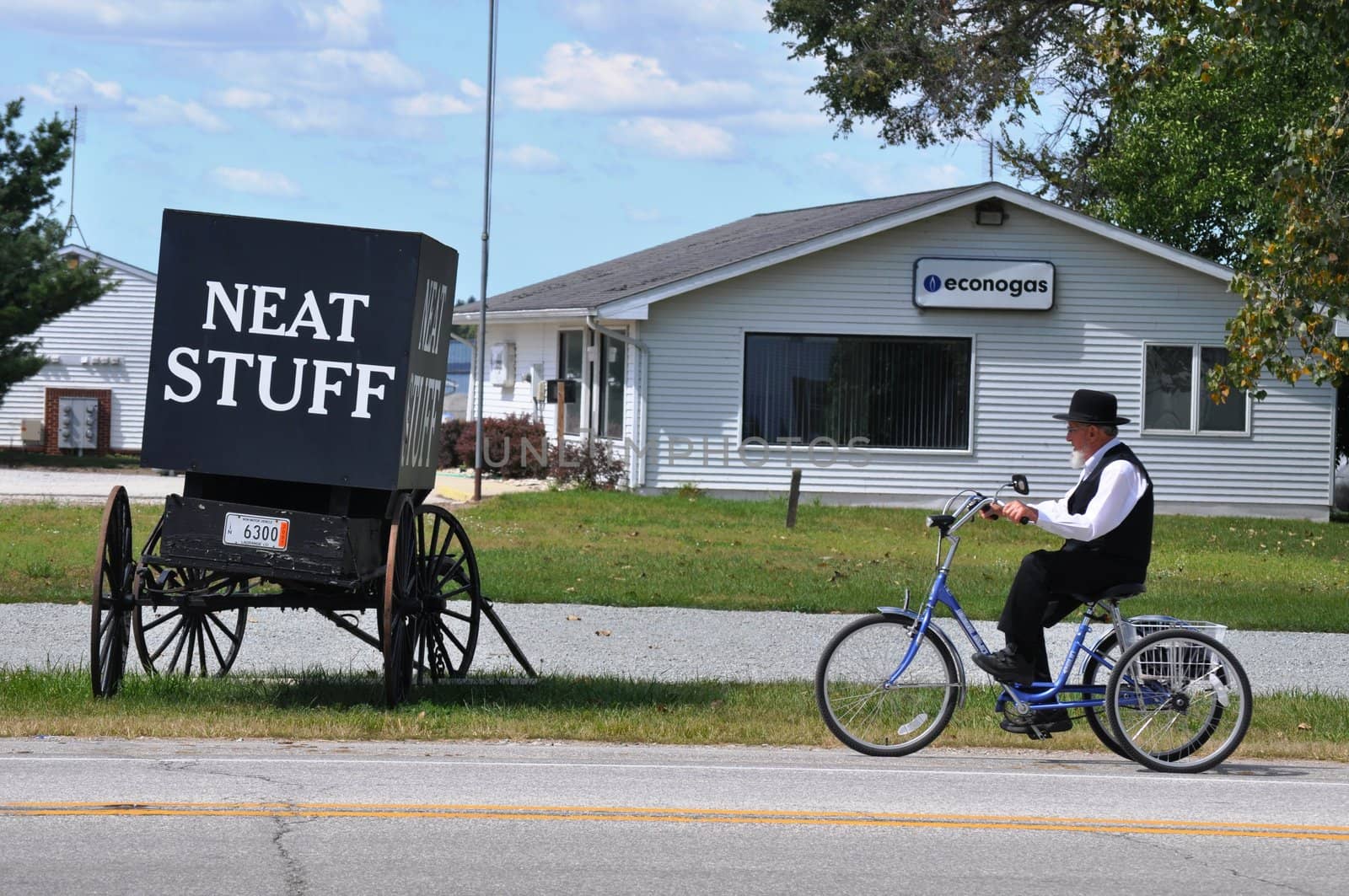 Amish man and Neat Stuff by RefocusPhoto