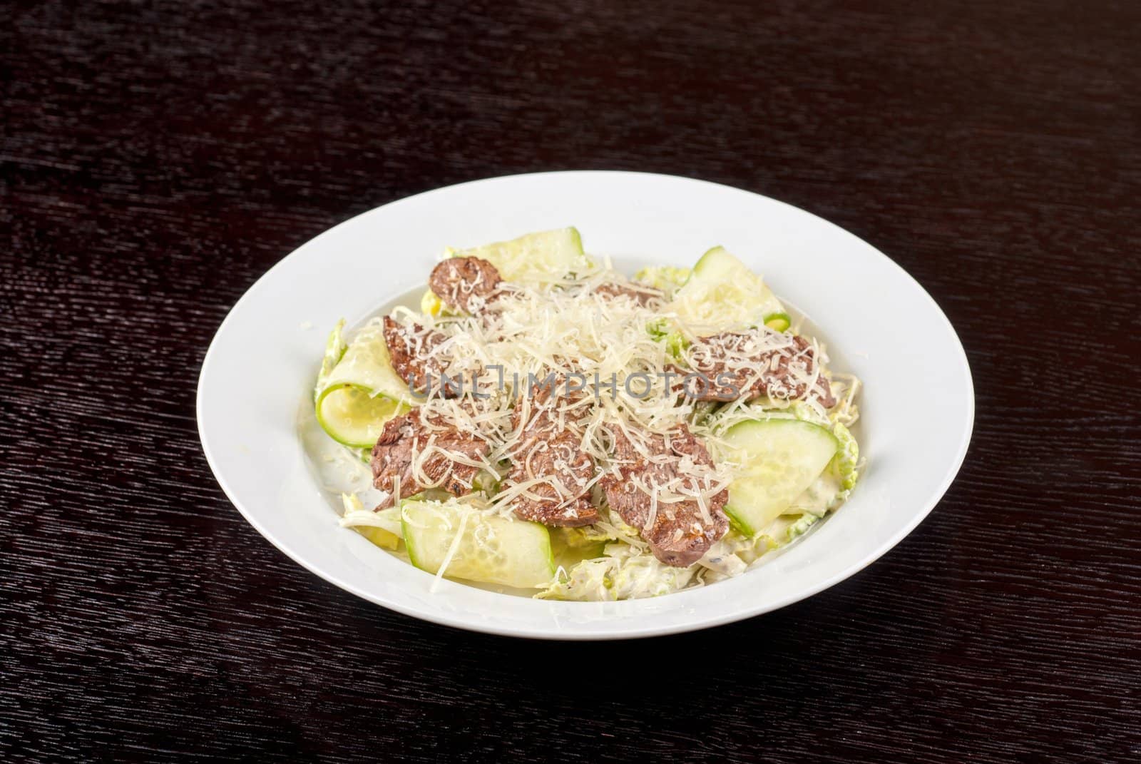 Salad with beef, lettuce, cucumber, string beans, Chinese cabbage and sauce