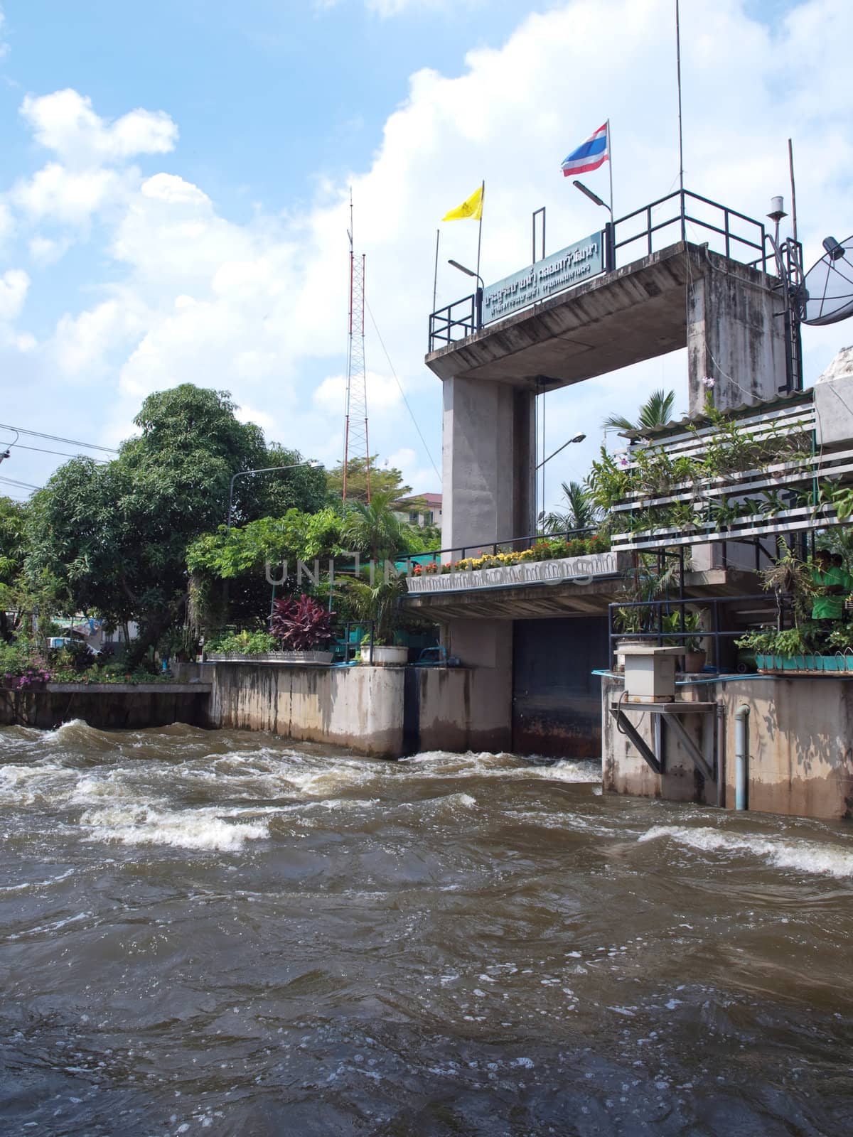 Thawi Watthana floodgate opening to relieve pressure from flooding, Bangkok, Thailand