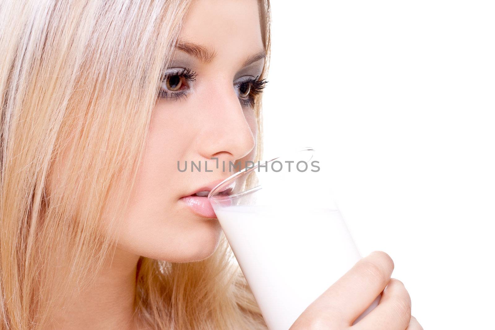 beautiful woman drinking milk on a white background