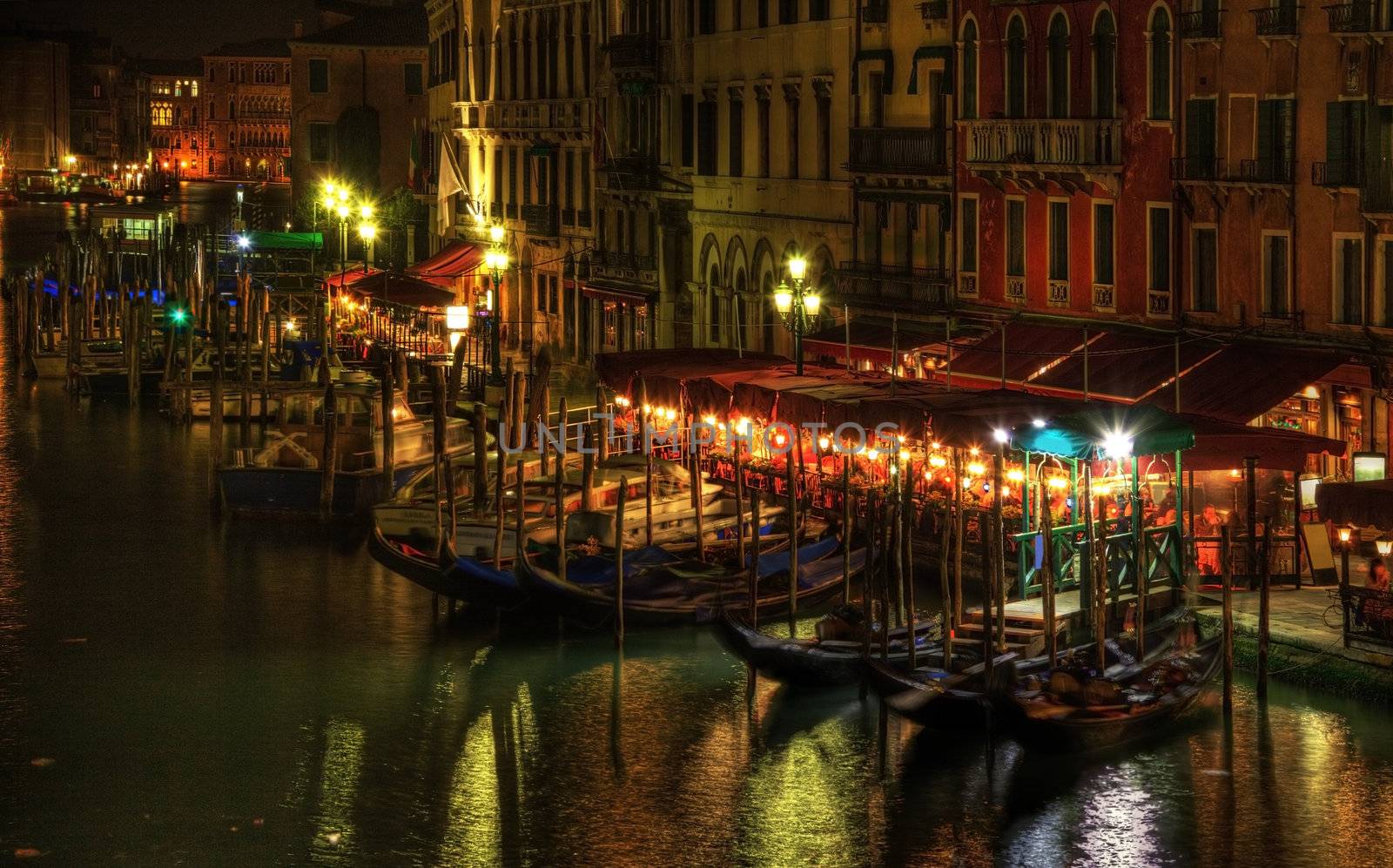 Night image in Venice on the Grand Canal in the vicinity of the Rialto Bridge.