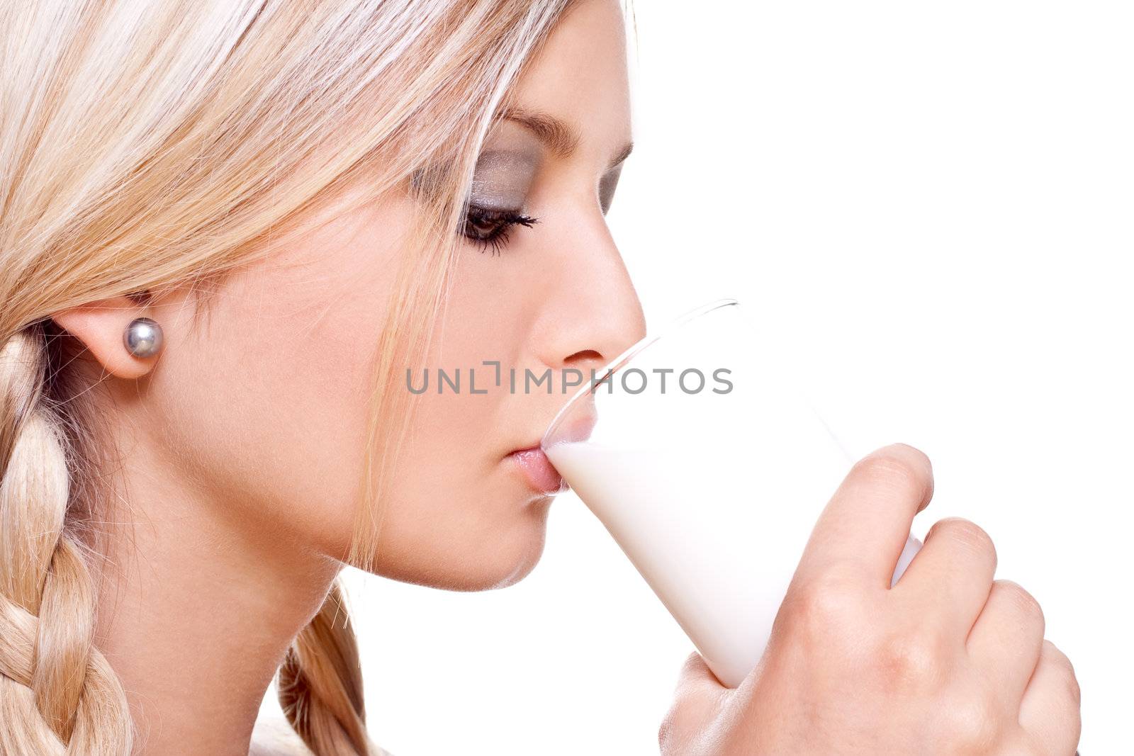 beautiful woman drinking milk on a white background