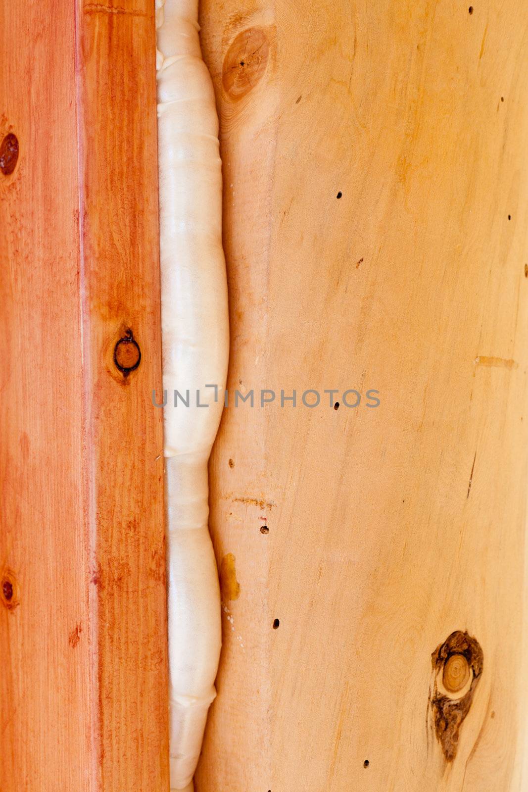 Polyurethane foam seals gap in wood construction by PiLens