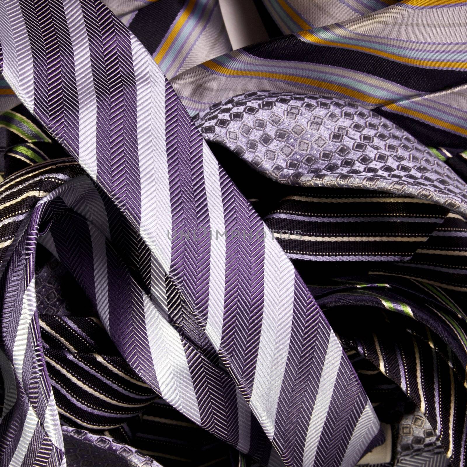 Assortment of mens neck ties in a pile