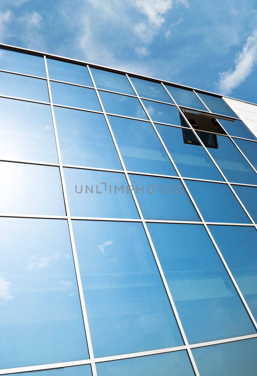 Open window in modern glass wall office building