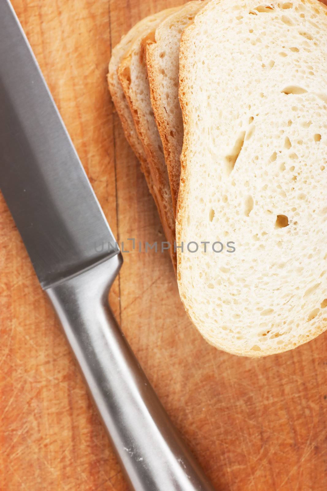Knife and bread on a wood board