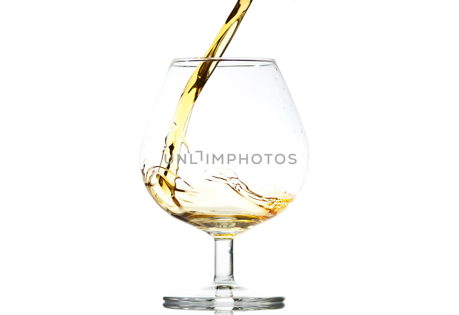 filling a glass of brandy by Discovod