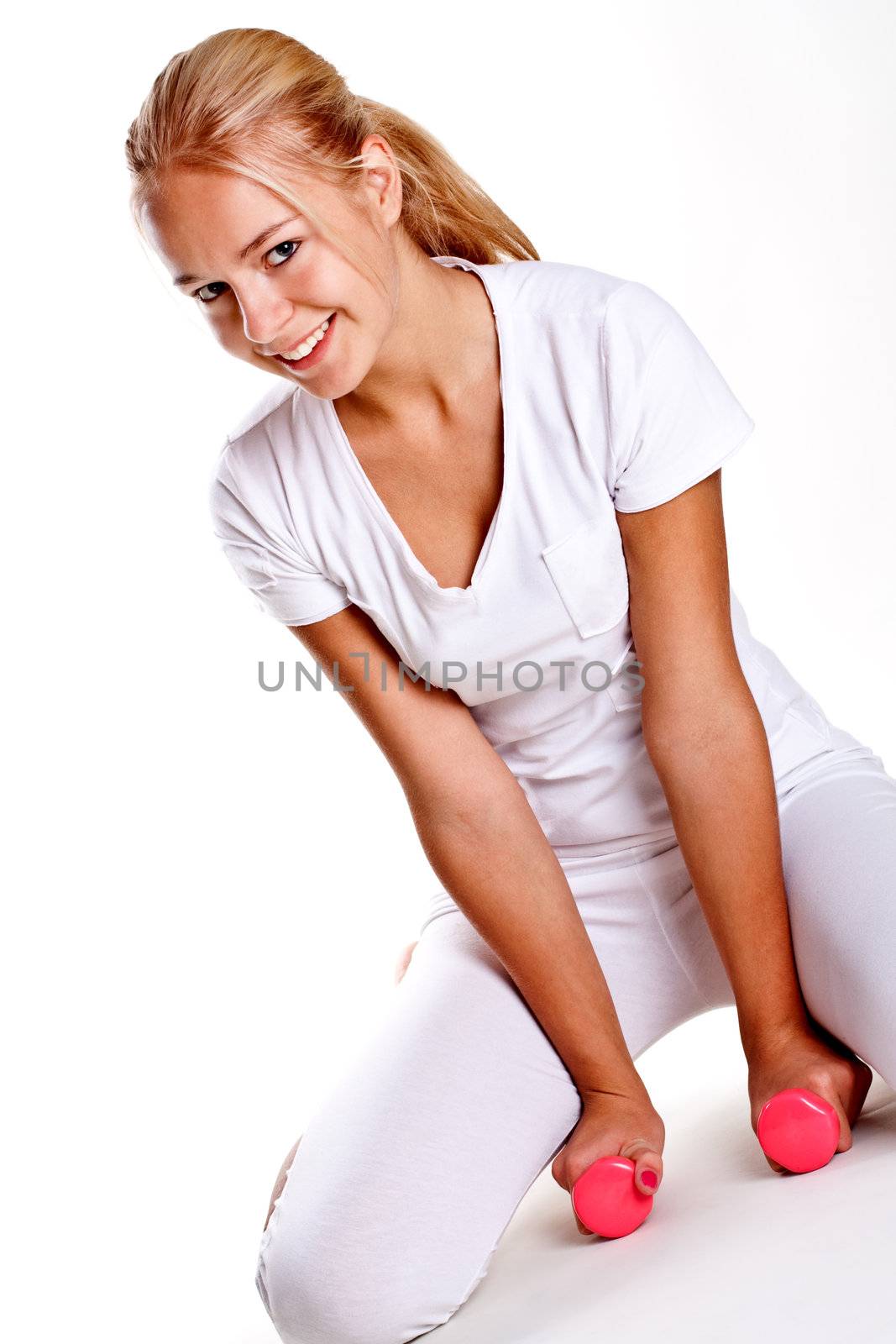 pink dumbbells in the hands of women on a white background