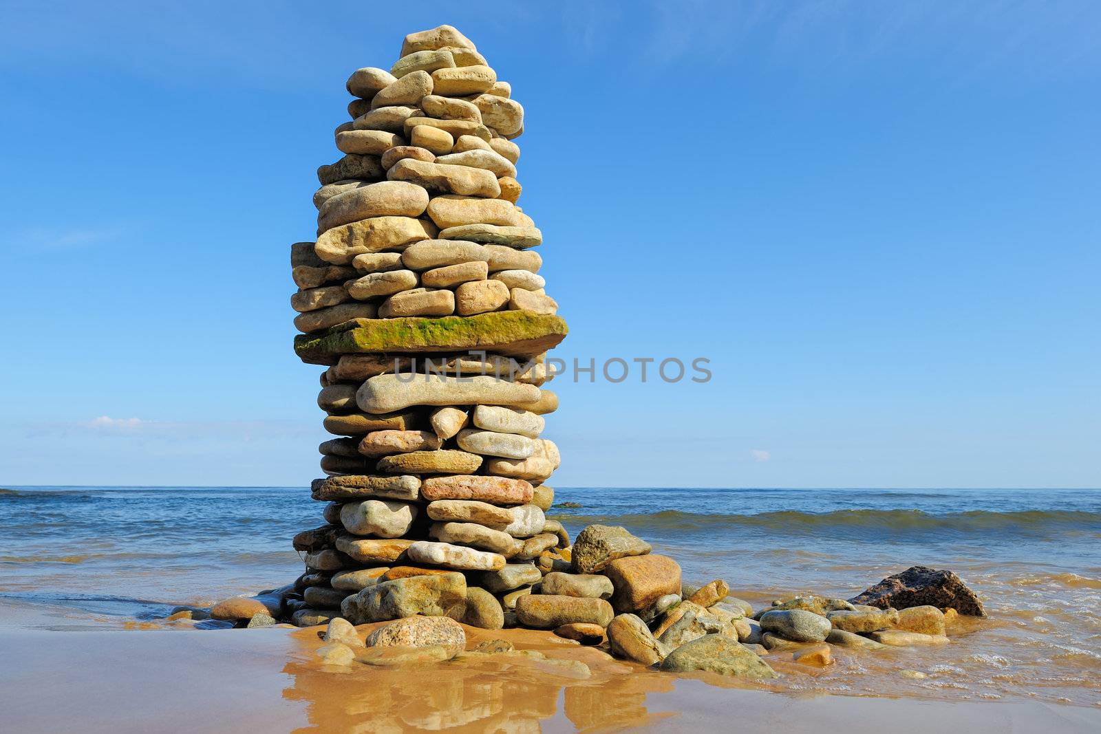 Stout pile of boulders on the sea shore